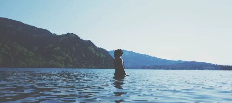 woman standing in calm water